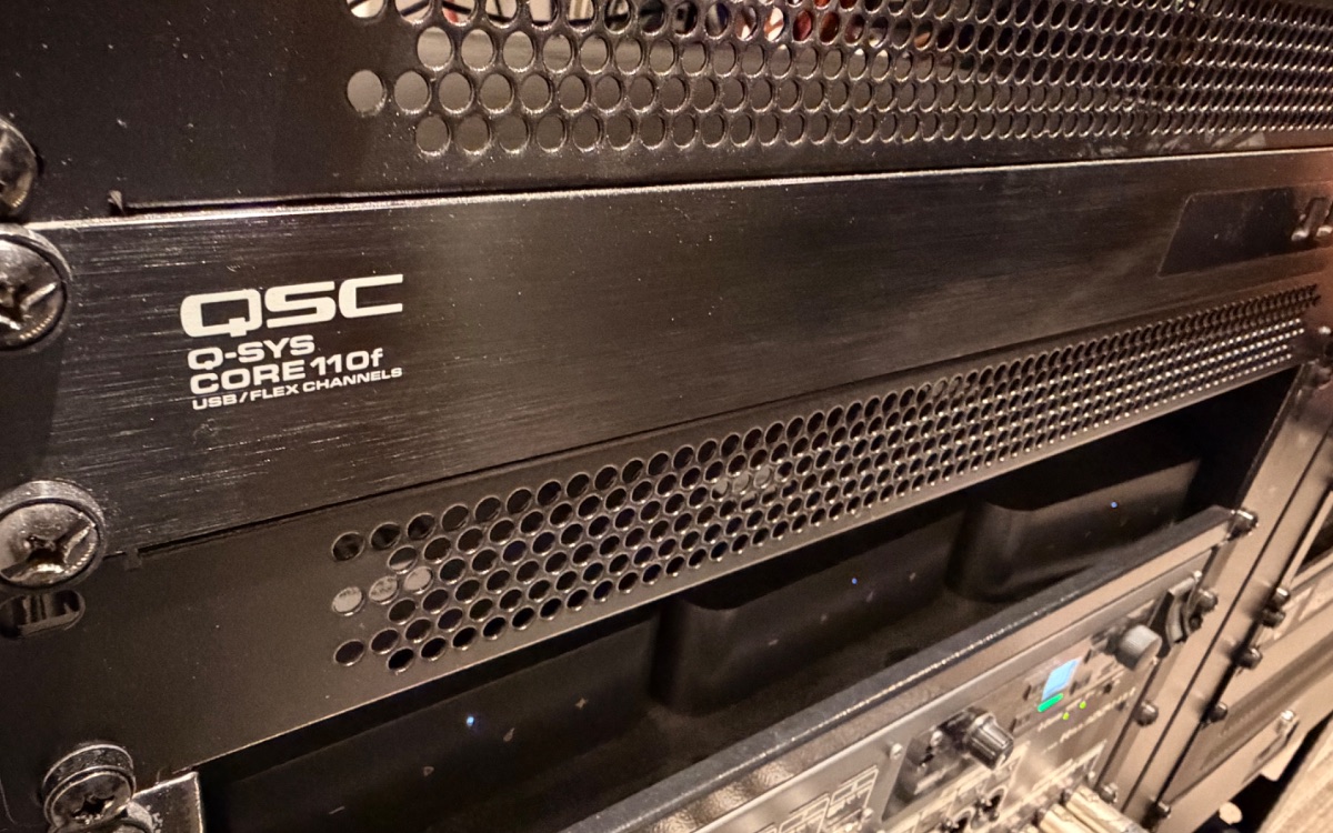 QSC Q-SYS Core audio processor powering an integrated multi-zone commercial audio system, installed by AES Integration